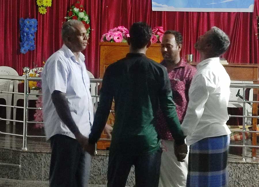 Men gathered in community and fellowship